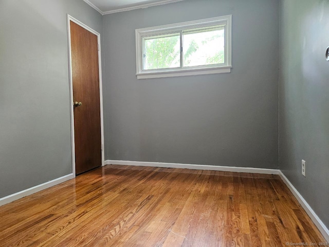 108 French St, Bristol, CT 06010 - unfurnished room featuring light wood finished floors and crown molding