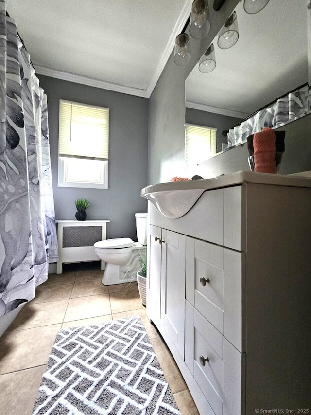 108 French St, Bristol, CT 06010 - full bath featuring crown molding, radiator heating unit, healthy amount of natural light, vanity, and tile patterned flooring