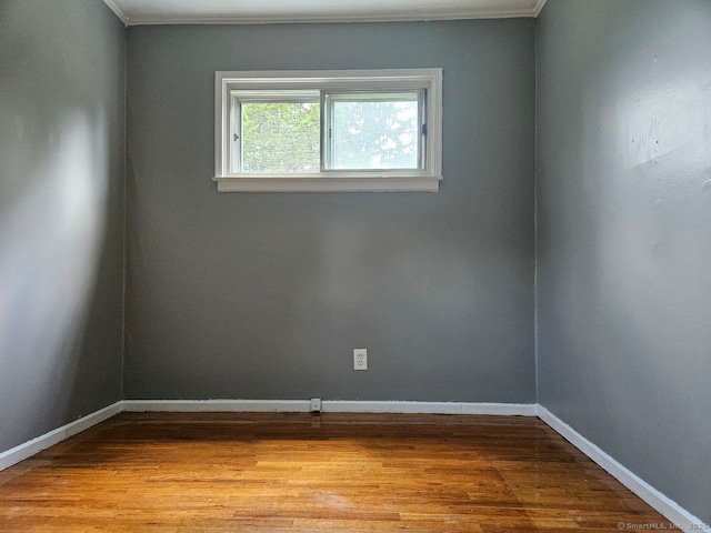 108 French St, Bristol, CT 06010 - empty room with wood finished floors and ornamental molding