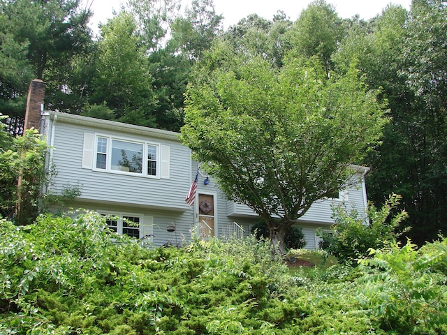 585 Perkins St, Bristol, CT 06010 - view of front of house featuring a chimney