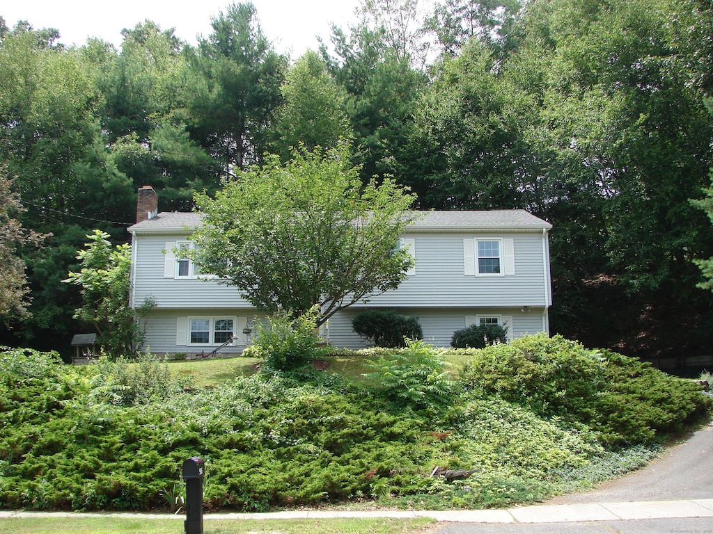 585 Perkins St, Bristol, CT 06010 - view of front of property with a chimney