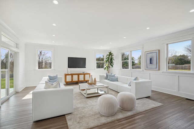 433 Belden Hill Rd, Wilton, CT 06897 - living room featuring ornamental molding, a decorative wall, wood finished floors, recessed lighting, and a wainscoted wall