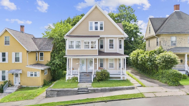 269 Olivia St, Derby, CT 06418 - view of front facade with covered porch and a front yard
