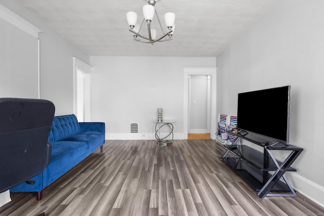 269 Olivia St, Derby, CT 06418 - sitting room with wood finished floors and a chandelier