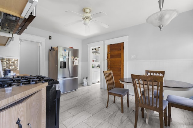 269 Olivia St, Derby, CT 06418 - dining space with a ceiling fan and wainscoting