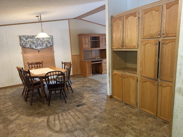 27 August Dr, Brooklyn, CT 06234 - dining room with wallpapered walls, vaulted ceiling, ornamental molding, and wainscoting