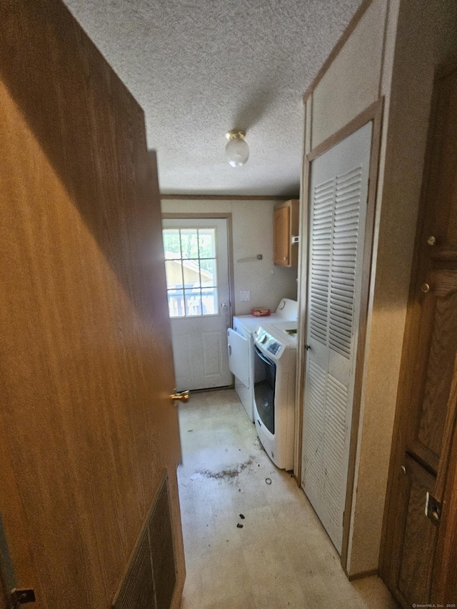 27 August Dr, Brooklyn, CT 06234 - laundry room with cabinet space, washing machine and clothes dryer, and a textured ceiling
