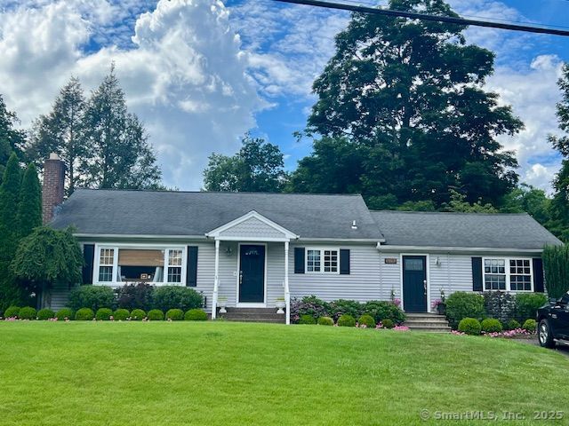 1157 Marion Ave, Southington, CT 06444 - ranch-style home with a front yard and a chimney