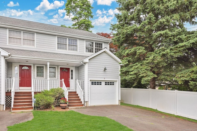 668 Kings Hwy W Unit 668, Fairfield, CT 06890 - view of front of home featuring driveway, an attached garage, a porch, and roof with shingles