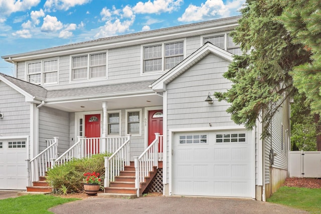 668 Kings Hwy W Unit 668, Fairfield, CT 06890 - view of front of home featuring a garage, roof with shingles, and asphalt driveway