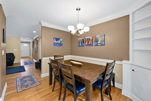 668 Kings Hwy W Unit 668, Fairfield, CT 06890 - dining room featuring a chandelier, crown molding, light wood-style flooring, and recessed lighting