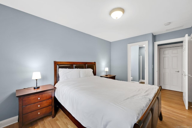 668 Kings Hwy W Unit 668, Fairfield, CT 06890 - bedroom with light wood-style floors and baseboards