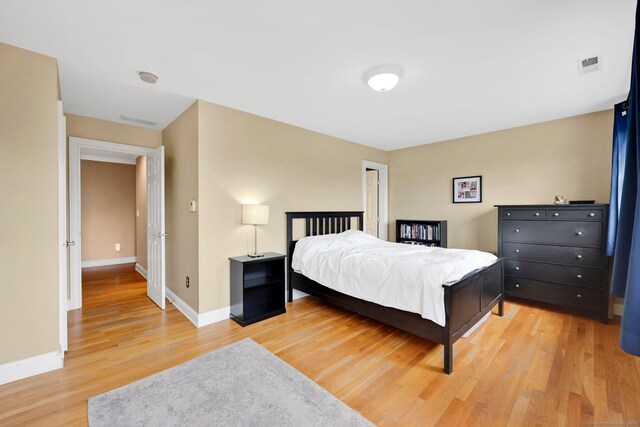 668 Kings Hwy W Unit 668, Fairfield, CT 06890 - bedroom with light wood-style flooring and baseboards