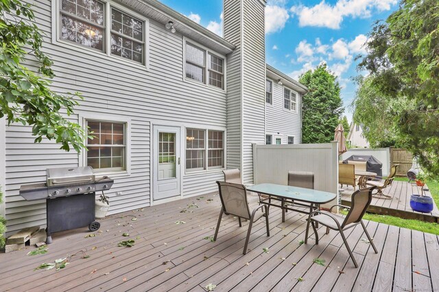 668 Kings Hwy W Unit 668, Fairfield, CT 06890 - deck with outdoor dining area and a grill