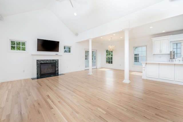 20 Stony Creek Rd Unit 20, Southington, CT 06479 - unfurnished living room featuring a high end fireplace, light wood finished floors, healthy amount of natural light, recessed lighting, and high vaulted ceiling