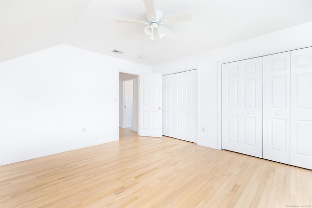 20 Stony Creek Rd Unit 20, Southington, CT 06479 - unfurnished bedroom featuring multiple closets, light wood finished floors, and a ceiling fan