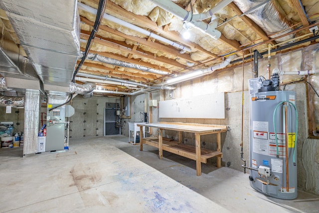 20 Stony Creek Rd Unit 20, Southington, CT 06479 - unfinished below grade area featuring gas water heater, a workshop area, and heating unit