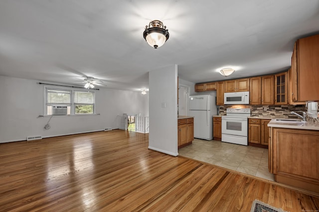 43 Kanter Dr, Vernon, CT 06066 - kitchen featuring white appliances, brown cabinets, cooling unit, open floor plan, and light countertops