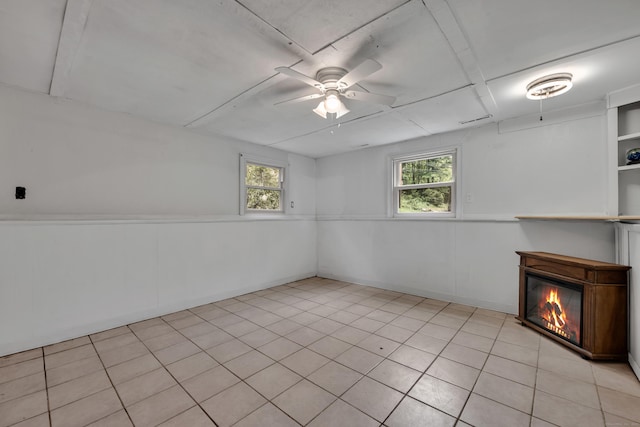 43 Kanter Dr, Vernon, CT 06066 - basement with a ceiling fan, plenty of natural light, and a glass covered fireplace