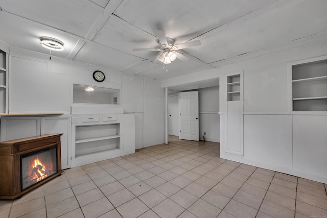 43 Kanter Dr, Vernon, CT 06066 - unfurnished living room with built in features, a ceiling fan, and a glass covered fireplace