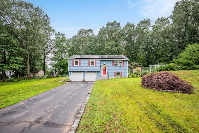 43 Kanter Dr, Vernon, CT 06066 - raised ranch featuring a garage, asphalt driveway, and a front yard