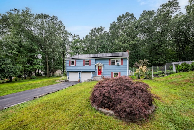 43 Kanter Dr, Vernon, CT 06066 - raised ranch with driveway, a garage, and a front yard