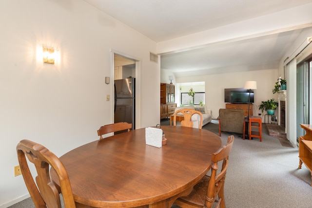 512 Heritage Vlg Unit B, Southbury, CT 06488 - dining room with light carpet and a brick fireplace
