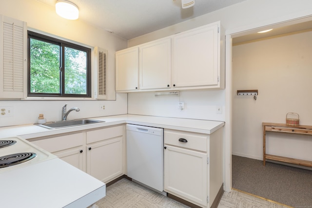 512 Heritage Vlg Unit B, Southbury, CT 06488 - kitchen with white dishwasher, light countertops, and white cabinetry