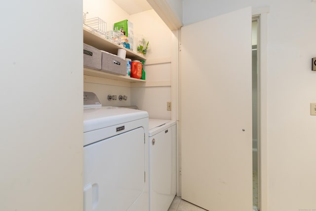 512 Heritage Vlg Unit B, Southbury, CT 06488 - laundry area featuring washing machine and dryer and light tile patterned floors