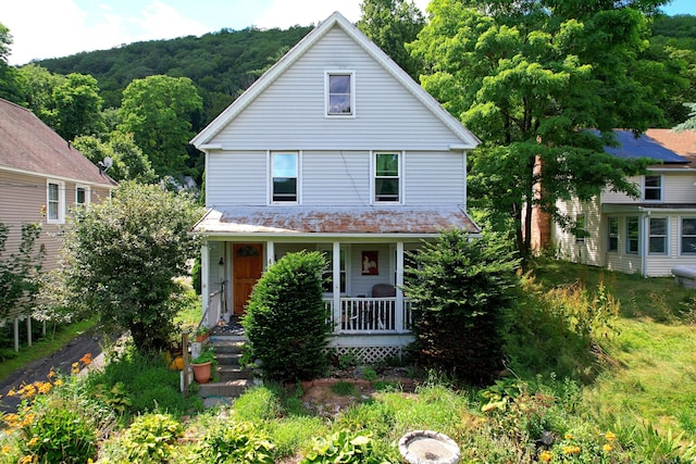 415 N Main St, Winchester, CT 06098 - american foursquare style home with a porch and a wooded view