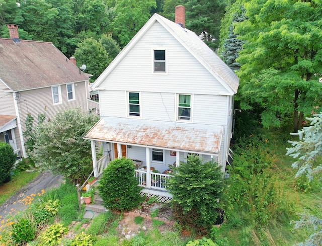 415 N Main St, Winchester, CT 06098 - view of front of home featuring a chimney, a porch, and a wooded view