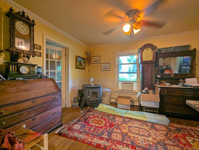 415 N Main St, Winchester, CT 06098 - bedroom with ornamental molding, wood finished floors, cooling unit, a baseboard radiator, and ceiling fan