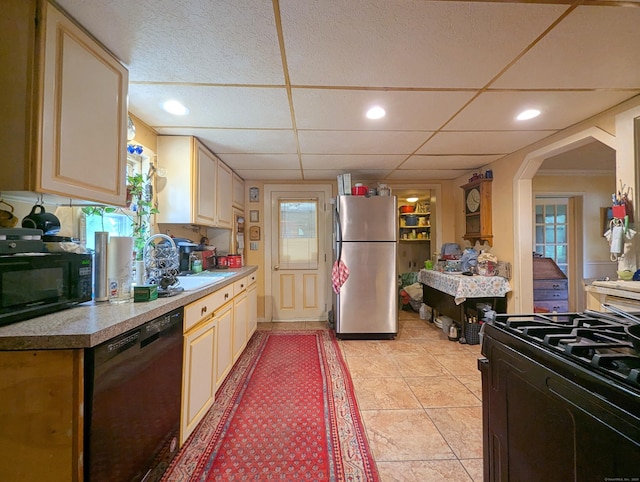 415 N Main St, Winchester, CT 06098 - kitchen featuring black appliances, light countertops, light tile patterned floors, arched walkways, and recessed lighting