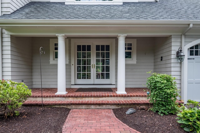 4 Brighton Ln, Simsbury, CT 06070 - view of exterior entry with french doors, roof with shingles, and covered porch
