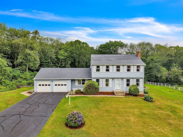 21 Briarcliffe Trl, Old Saybrook, CT 06475 - colonial inspired home featuring a chimney, driveway, a garage, and roof with shingles