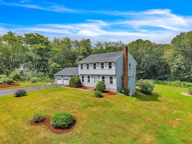 21 Briarcliffe Trl, Old Saybrook, CT 06475 - colonial house with asphalt driveway, a chimney, a front yard, and an attached garage
