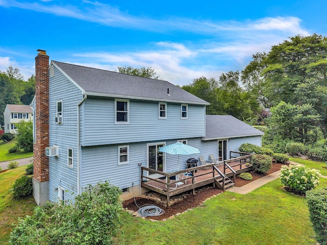 21 Briarcliffe Trl, Old Saybrook, CT 06475 - rear view of house with a chimney, a yard, a wooden deck, and a shingled roof
