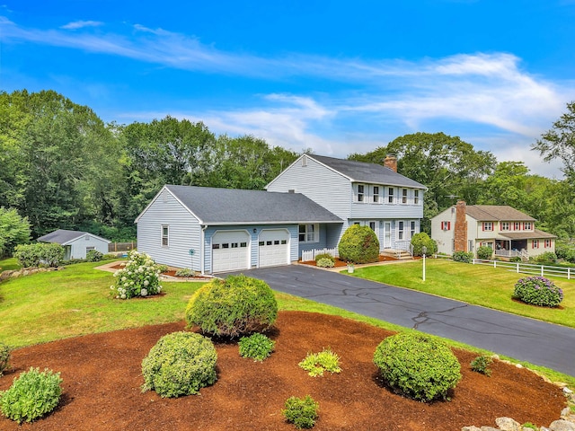 21 Briarcliffe Trl, Old Saybrook, CT 06475 - colonial-style house with a garage, asphalt driveway, and a chimney