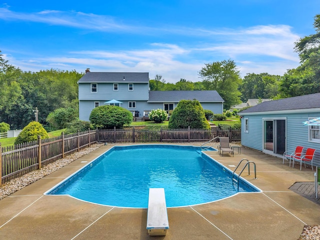 21 Briarcliffe Trl, Old Saybrook, CT 06475 - view of swimming pool with a patio, a diving board, and a fenced backyard