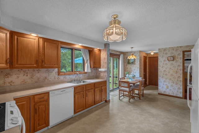 21 Briarcliffe Trl, Old Saybrook, CT 06475 - kitchen featuring dishwasher, stove, wallpapered walls, a textured ceiling, and light countertops