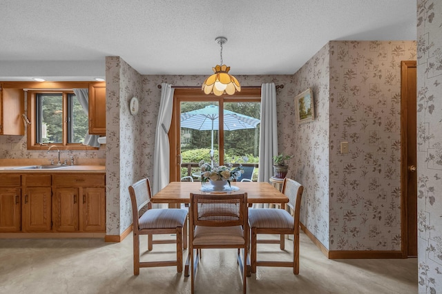 21 Briarcliffe Trl, Old Saybrook, CT 06475 - dining room featuring wallpapered walls, a textured ceiling, and light colored carpet