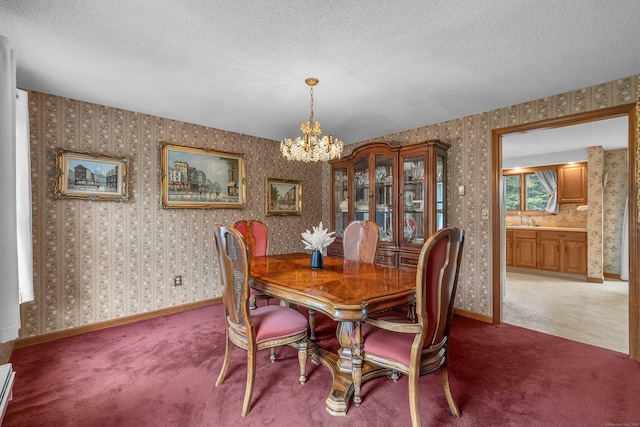 21 Briarcliffe Trl, Old Saybrook, CT 06475 - dining room with a chandelier, a textured ceiling, light carpet, wallpapered walls, and a baseboard radiator