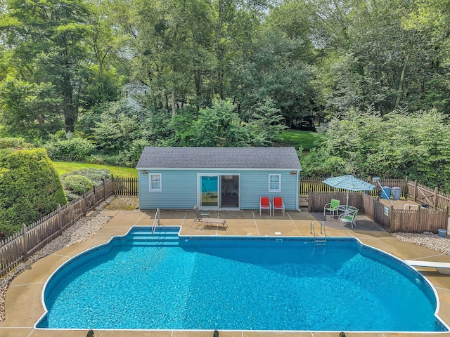 21 Briarcliffe Trl, Old Saybrook, CT 06475 - view of swimming pool featuring an outbuilding, an exterior structure, a fenced backyard, and a patio area