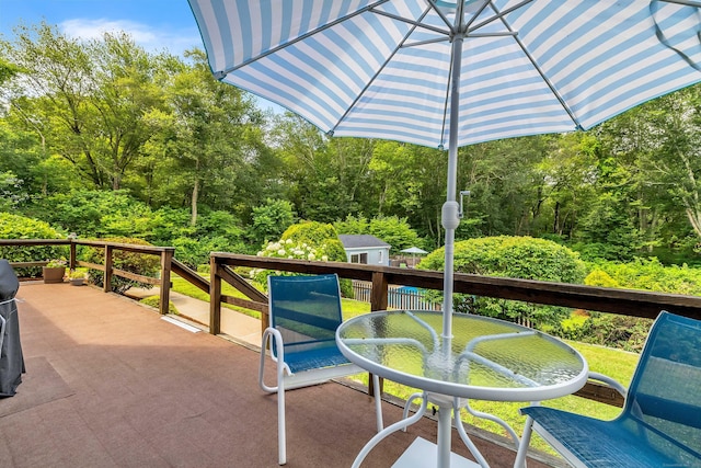 21 Briarcliffe Trl, Old Saybrook, CT 06475 - view of patio featuring outdoor dining space and a wooded view