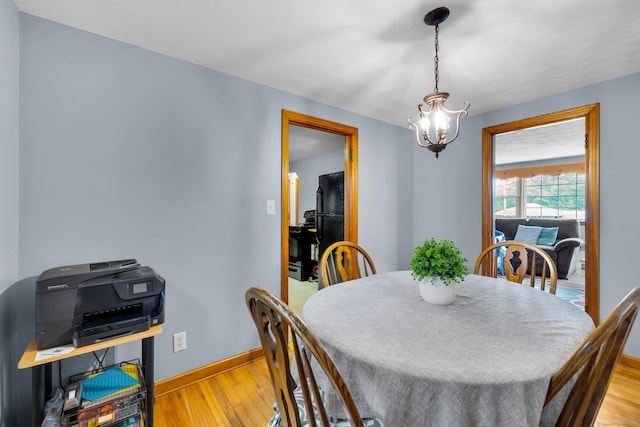 141 Orchard St, Meriden, CT 06450 - dining space featuring a chandelier and light wood-style floors