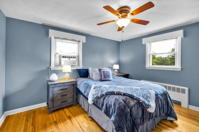 141 Orchard St, Meriden, CT 06450 - bedroom featuring radiator, cooling unit, light wood-style flooring, and a ceiling fan