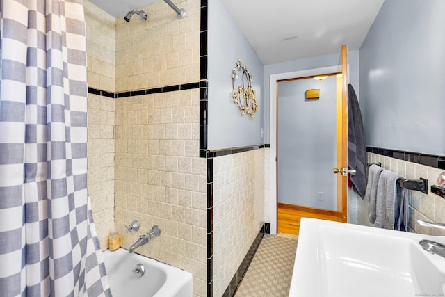 141 Orchard St, Meriden, CT 06450 - bathroom featuring tile walls, shower / bath combination with curtain, and wainscoting