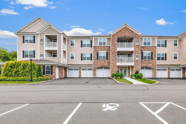 605 Brookside Ct Unit 605, Newtown, CT 06470 - view of property with a garage and driveway