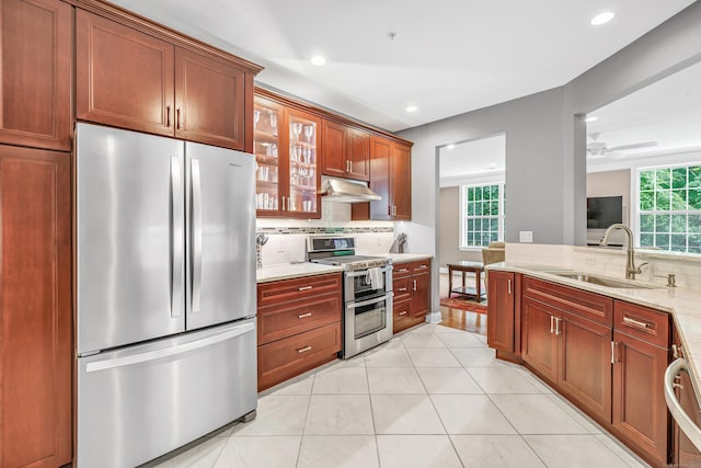 605 Brookside Ct Unit 605, Newtown, CT 06470 - kitchen with appliances with stainless steel finishes, tasteful backsplash, recessed lighting, under cabinet range hood, and glass insert cabinets