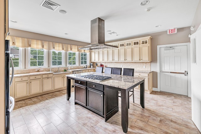 605 Brookside Ct Unit 605, Newtown, CT 06470 - kitchen featuring cream cabinets, island range hood, decorative backsplash, light stone counters, and recessed lighting